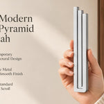 Large Modern Silver Pyramid Mezuzah pictured in hand as a softly brushed silver aluminum mezuzah cover with three graduated bars and a contemporary stepped design, alongside its name and illustrated product features in a wide social-sharing image