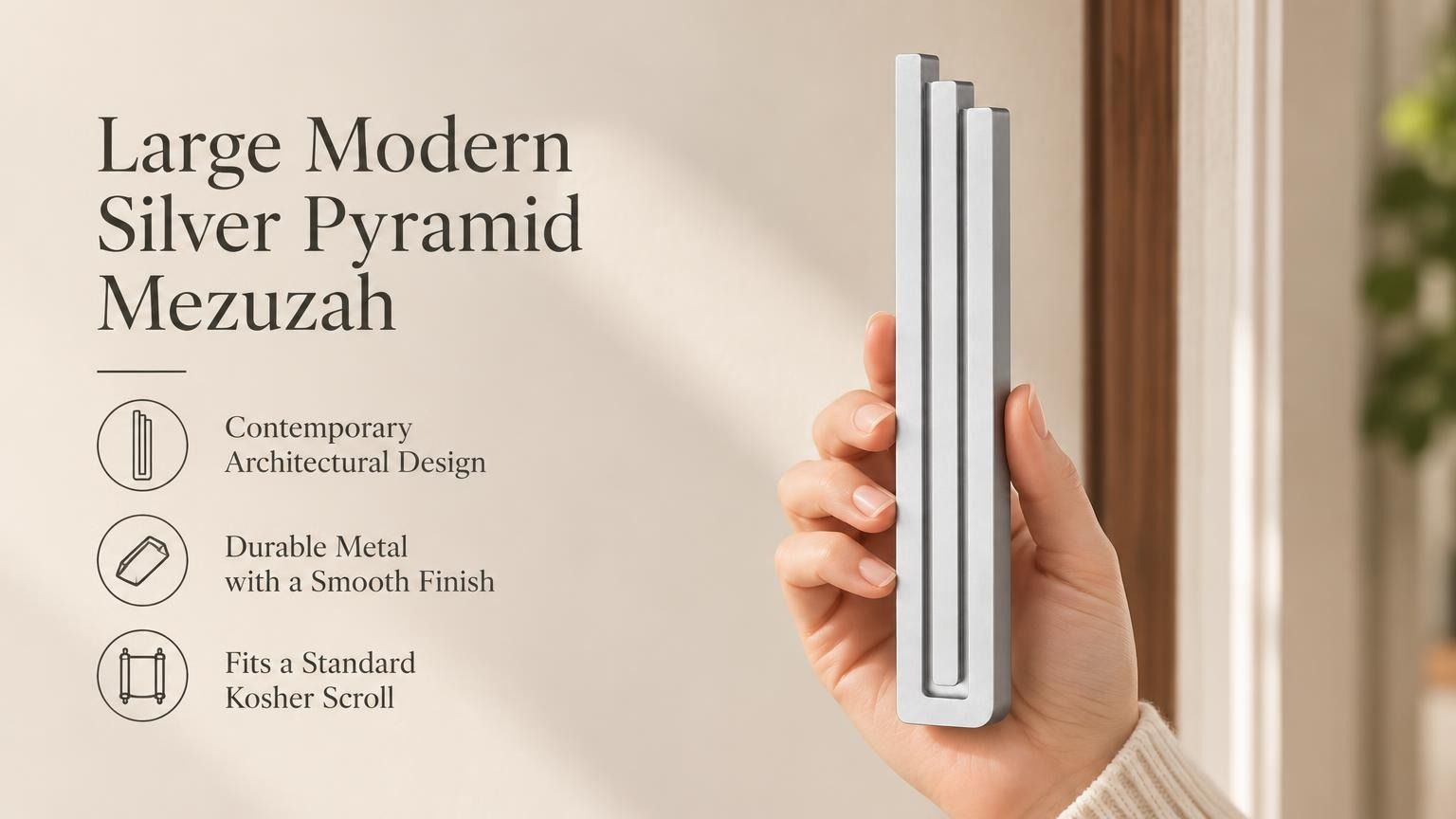 Large Modern Silver Pyramid Mezuzah pictured in hand as a softly brushed silver aluminum mezuzah cover with three graduated bars and a contemporary stepped design, alongside its name and illustrated product features in a wide social-sharing image