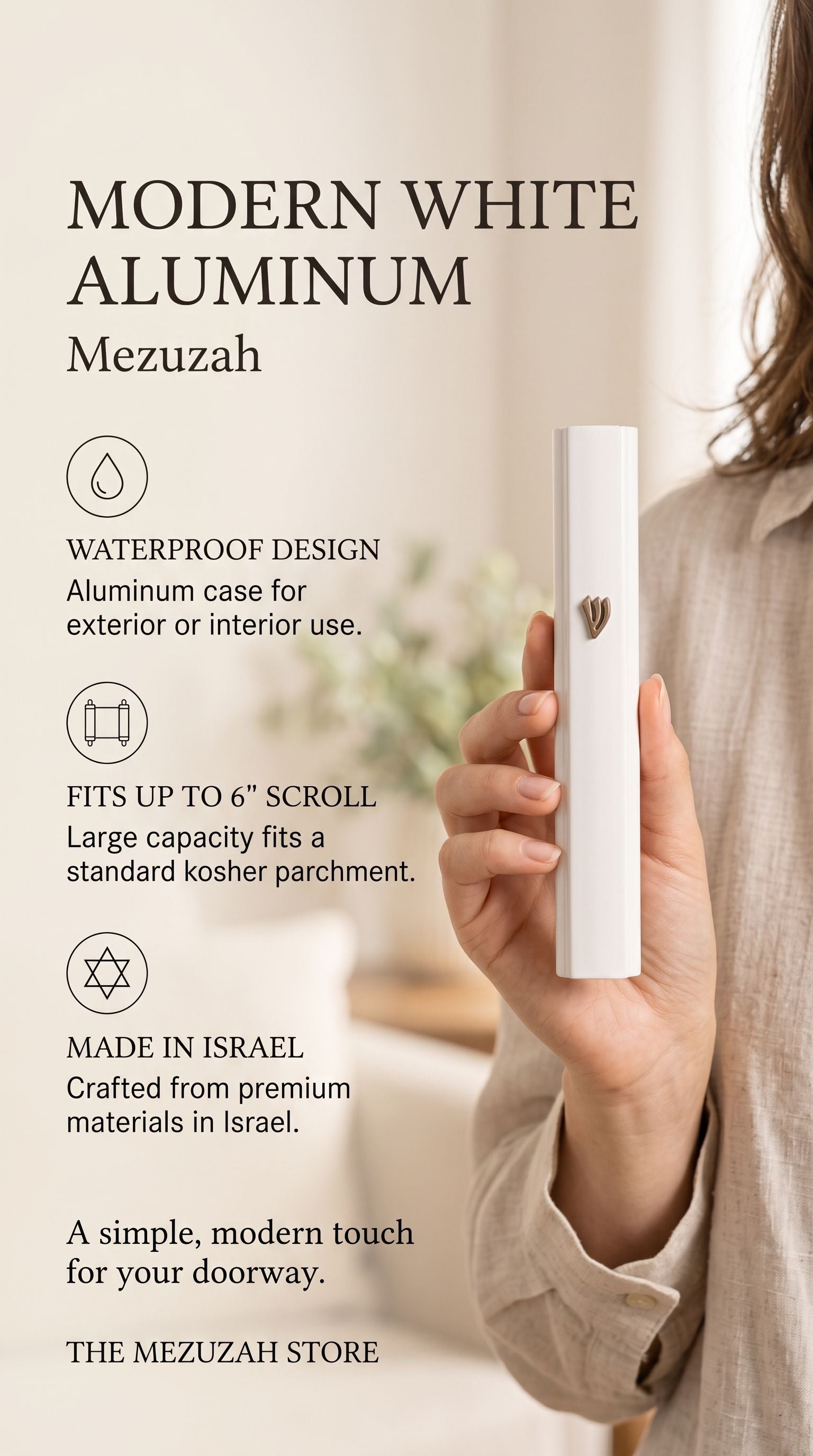 holding the large modern white aluminum outdoor mezuzah case indoors, showing its raised Hebrew Shin beside graphic callouts for waterproof use, a scroll up to six inches and Israeli origin