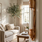 Interior doorway with handcrafted olive wood mezuzah featuring exposed glass scroll chamber, mounted on the right side of the door frame.