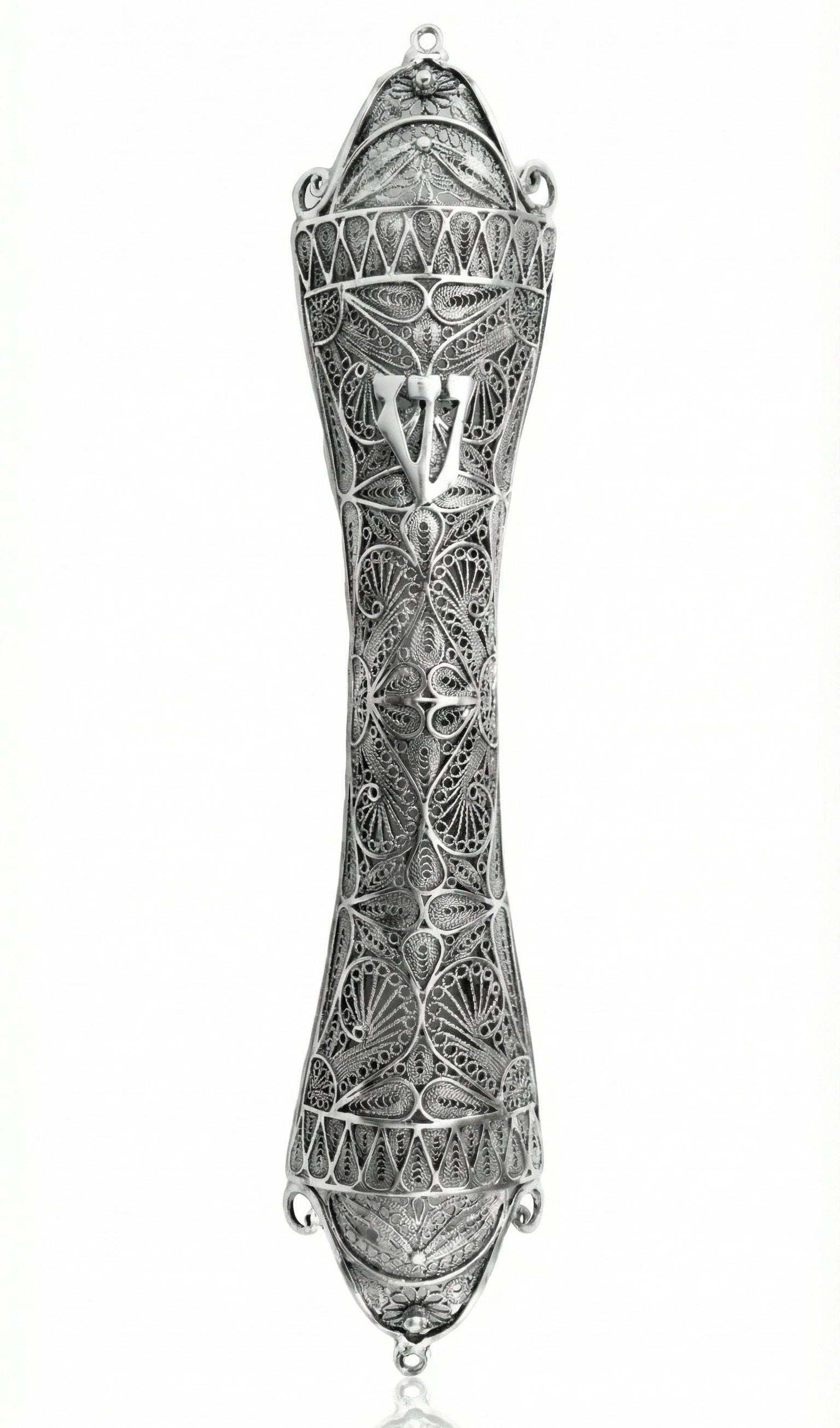 Large handcrafted sterling silver mezuzah with detailed filigree leaf and Sha-dai on a bright white studio background with subtle reflection.