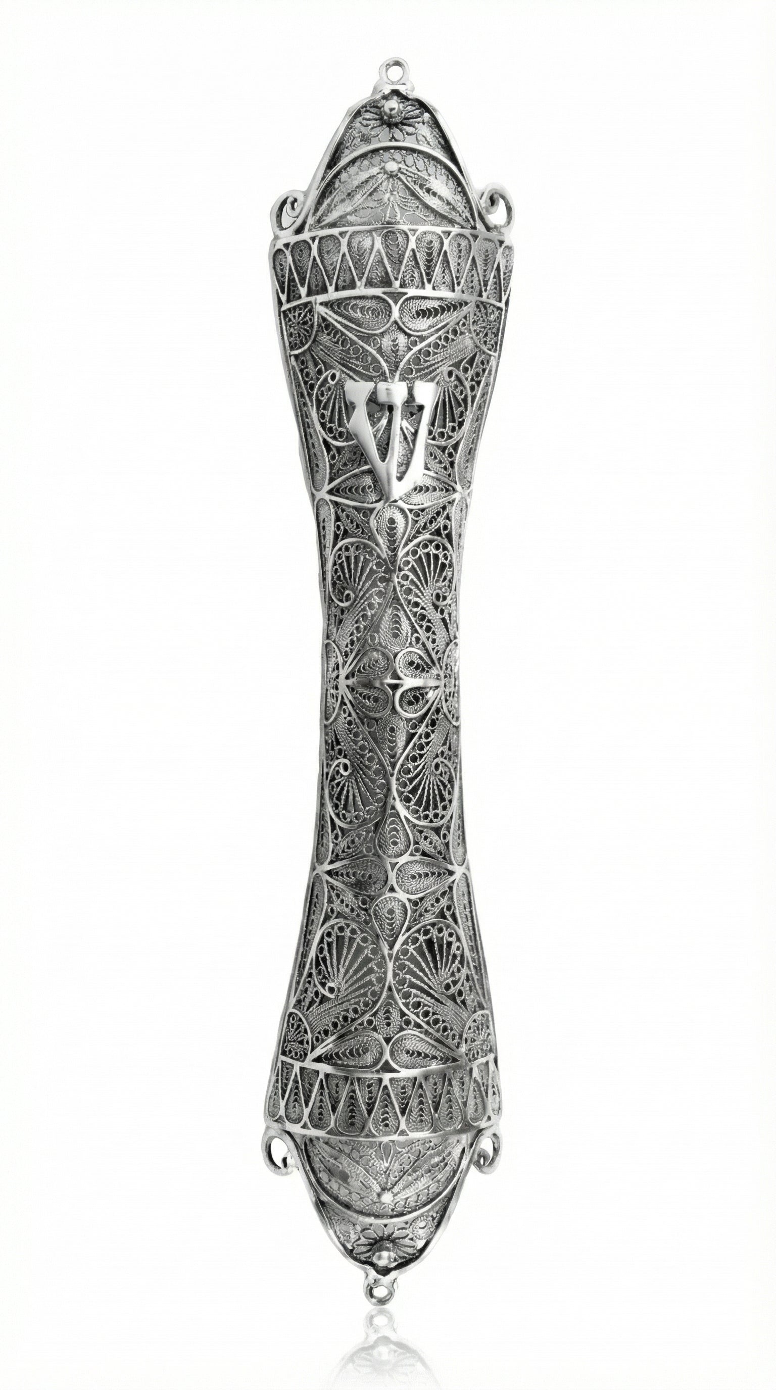 Large handcrafted sterling silver mezuzah with detailed filigree leaf and Sha-dai on a bright white studio background with subtle reflection.