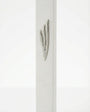 Extra large modern white cement mezuzah, 9 inches tall, with detailed Hebrew engravings and decorative motifs on a bright white studio background with soft reflection.