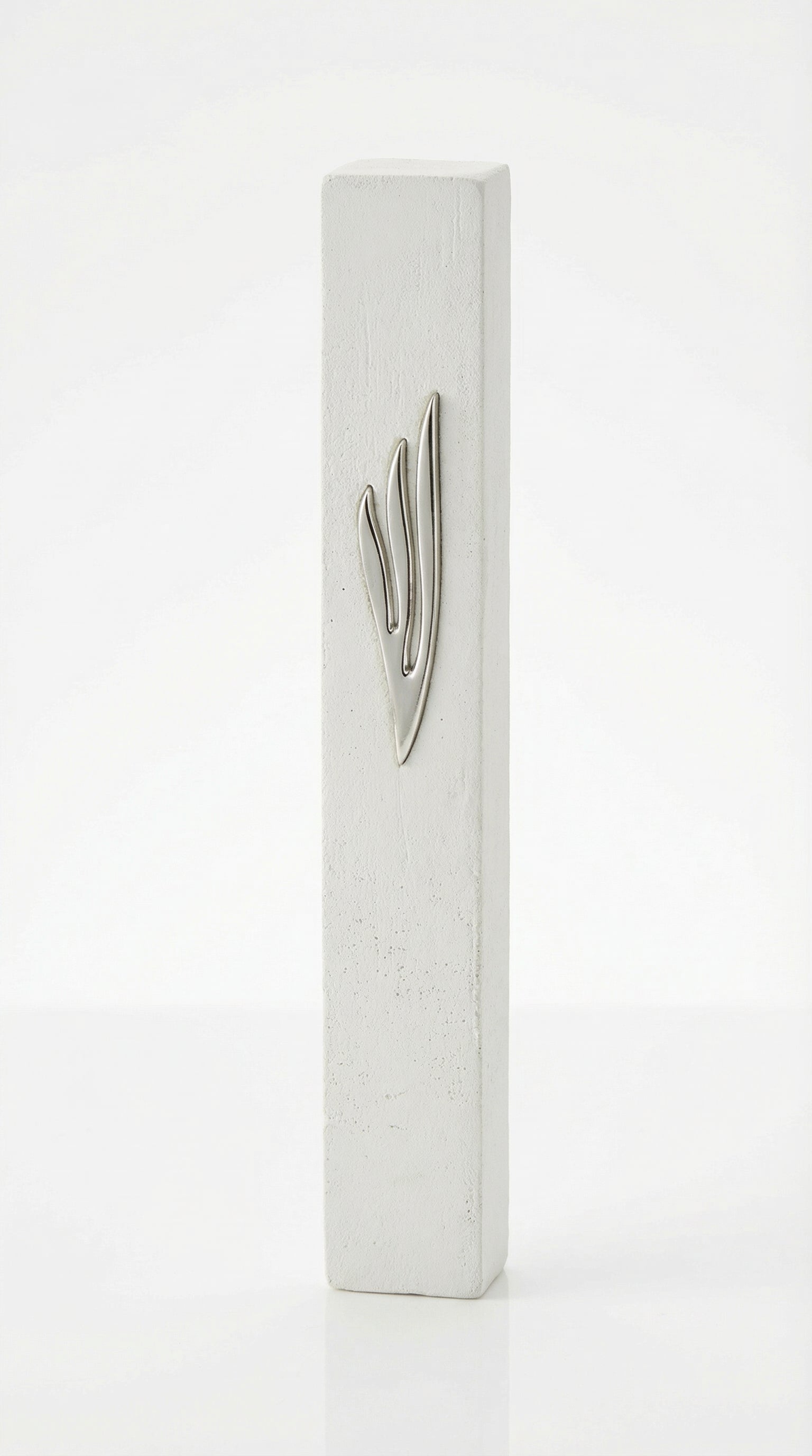 Extra large modern white cement mezuzah, 9 inches tall, with detailed Hebrew engravings and decorative motifs on a bright white studio background with soft reflection.