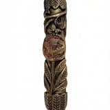 Elevated image of a brass Leafs Mezuzah with detailed engravings, Hebrew lettering, and a polished finish, mounted on a white studio backdrop.