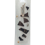 Elegant glass mezuzah with Hebrew inscriptions, designed for home doorways, displayed on a bright white studio background with soft reflection.