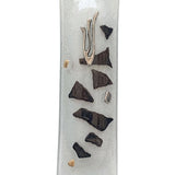 Elegant glass mezuzah with Hebrew inscriptions, designed for home doorways, displayed on a bright white studio background with soft reflection.