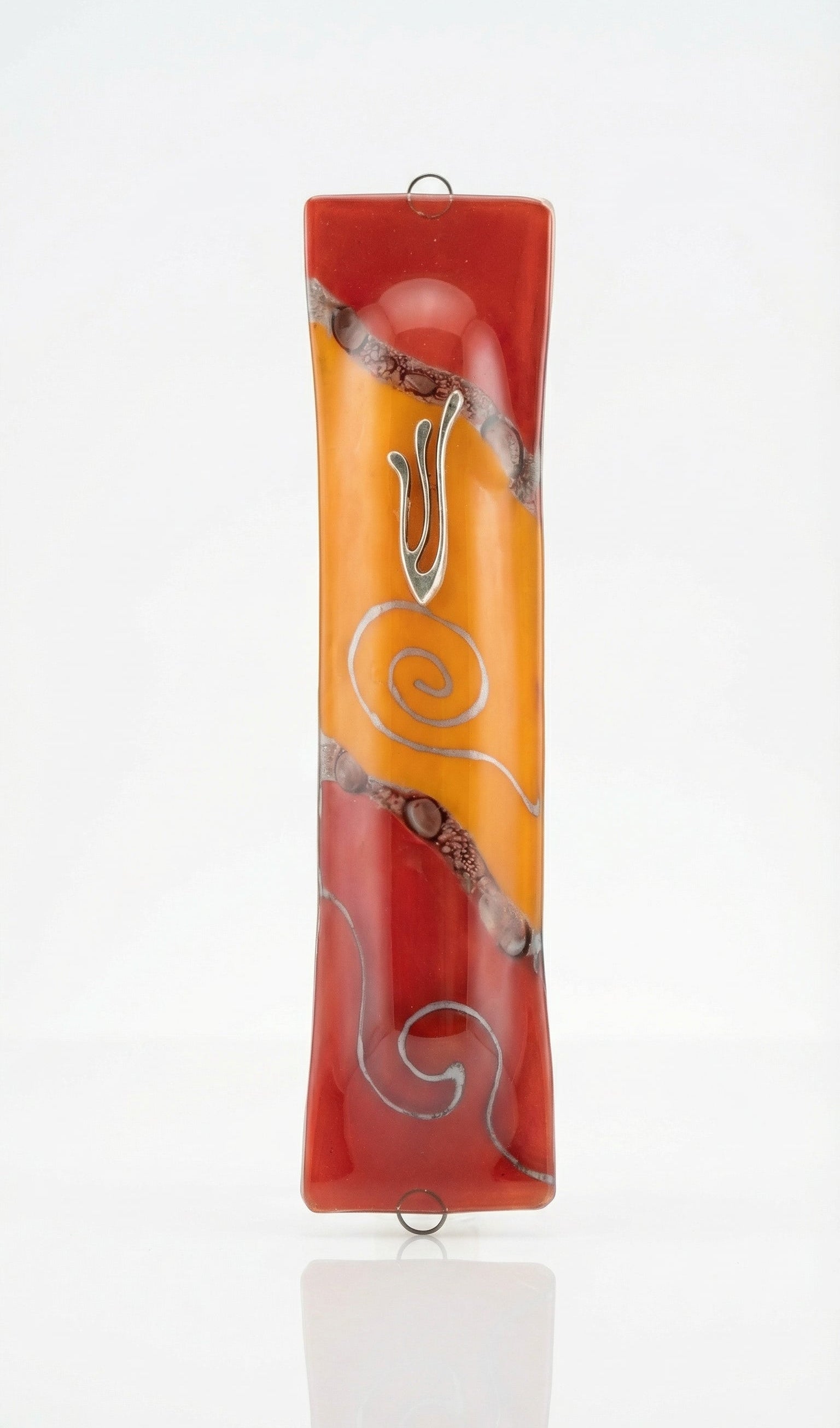 Elegant glass mezuzah, 5 1/4 inches tall, with detailed Hebrew engravings, polished surface, displayed on a bright white studio background with soft reflection.