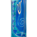 Elegant light blue glass mezuzah measuring 4.5 inches tall with engraved Hebrew letters and decorative motifs, mounted on a white background with subtle reflection.