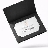 Elegant gift card inside an open matte black holder, showcasing refined typography and a minimalist design for Jewish gifting.
