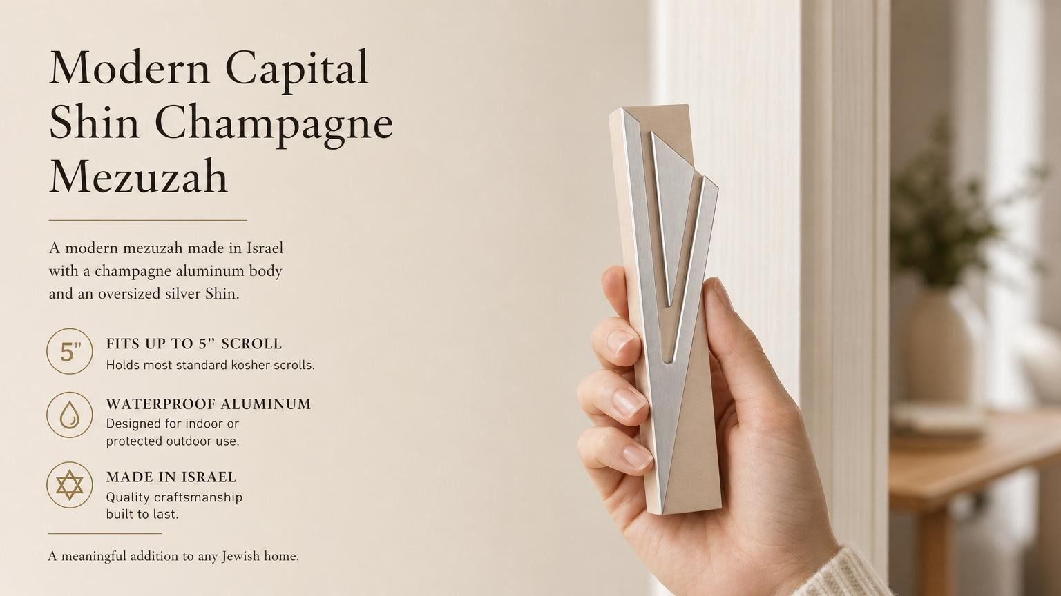 Hand-holding the exact Modern Capital Shin Champagne Mezuzah, highlighting its design and materials in a natural setting for e-commerce.
