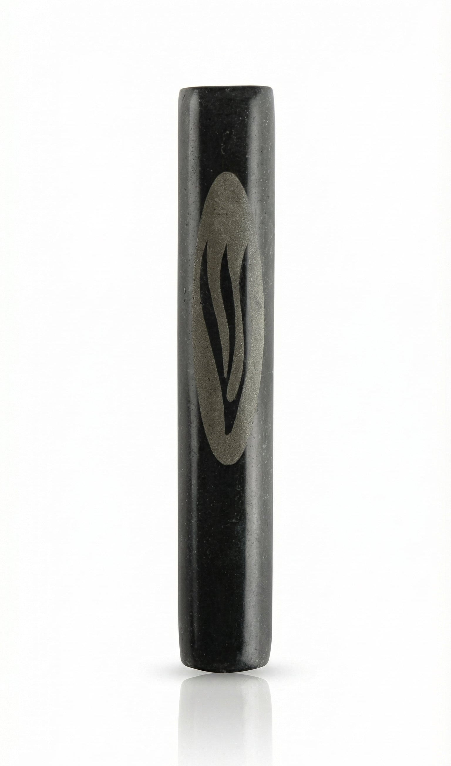 Black marble Mezuzah handcrafted in Israel with intricate Hebrew engravings, surface textures, and a polished finish on a white background with soft reflection.
