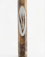 Brown marble mezuzah handcrafted in Israel with detailed engravings and Hebrew letters, presented on a pure white background with a soft reflection.