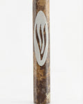 Brown marble mezuzah handcrafted in Israel with detailed engravings and Hebrew letters, presented on a pure white background with a soft reflection.
