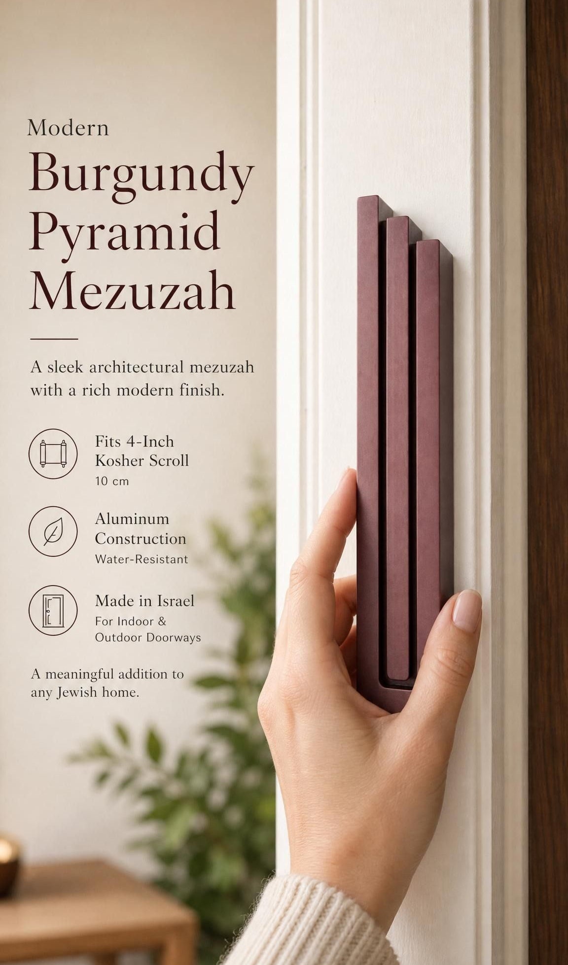 Individual holding the exact modern burgundy pyramid mezuzah at realistic scale, with space for editorial text, emphasizing its precise dimensions and design features.