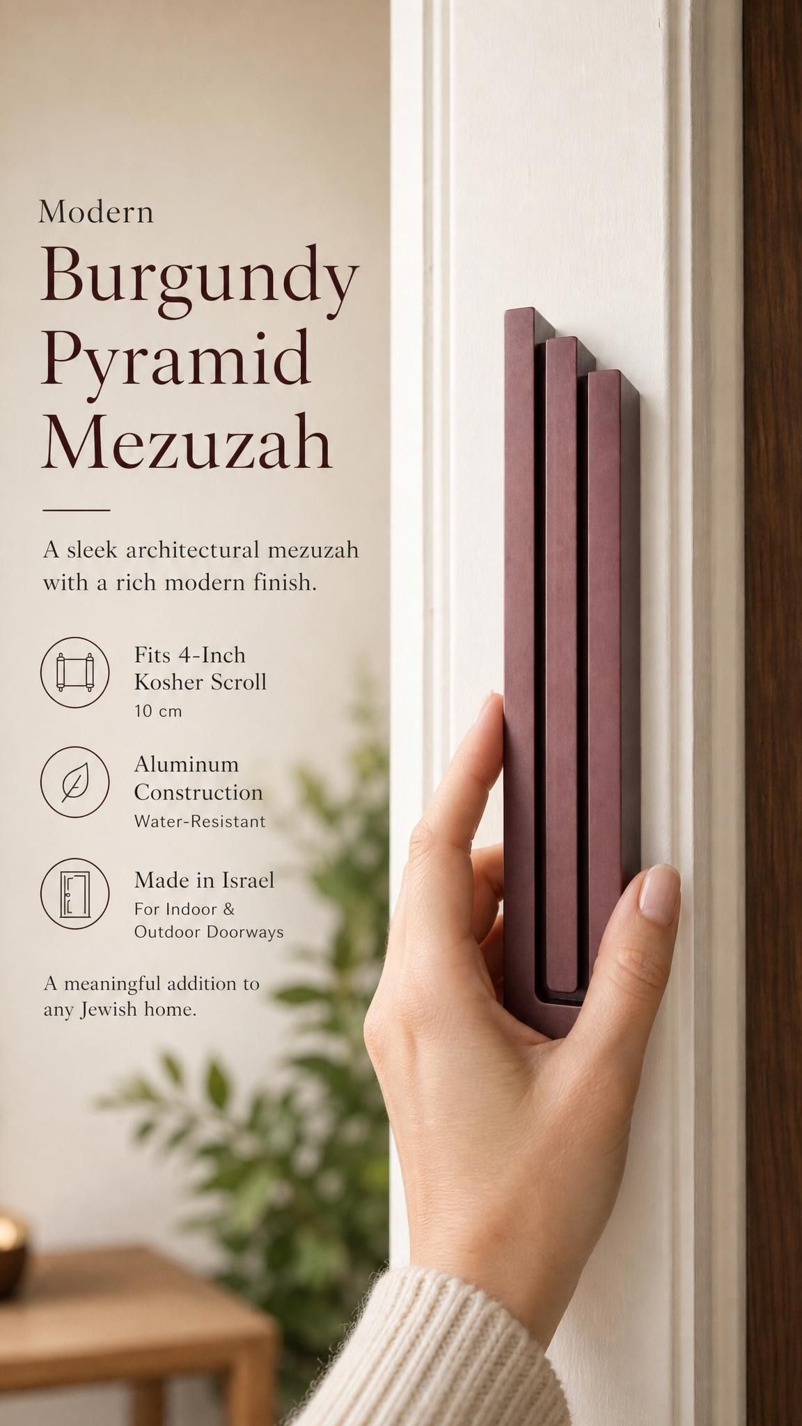 Individual holding the exact modern burgundy pyramid mezuzah at realistic scale, with space for editorial text, emphasizing its precise dimensions and design features.