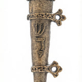 Solid brass medieval mezuzah with bird motif and yellow crystal on a white studio background, showcasing fine craftsmanship and detailed design.