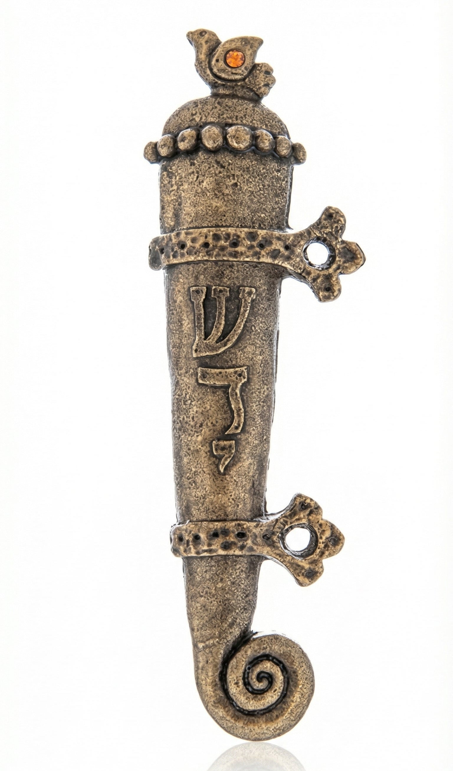 Solid brass medieval mezuzah with bird motif and yellow crystal on a white studio background, showcasing fine craftsmanship and detailed design.