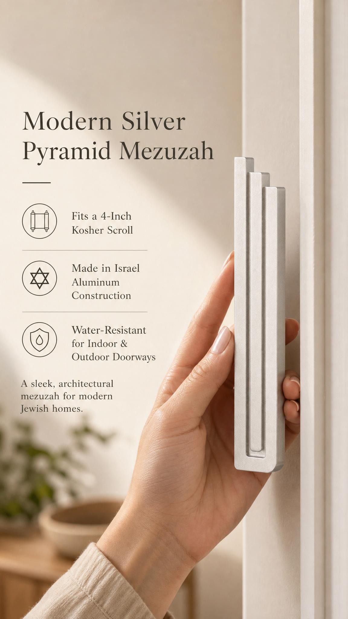 Elegant display of a person presenting the modern silver pyramid mezuzah, emphasizing its clean architectural style.