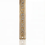 Acrylic Shema Mezuzah on white background with subtle reflection, front view showing detailed design and Hebrew writing.