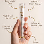 Person holding the clear lucite mezuzah with instructional arrows pointing to features, on light background.