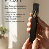 Elegant hand-holding the black aluminum mezuzah against a neutral, understated background for product emphasis.