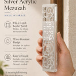 Person holding the Blessings of Peace Silver Acrylic Mezuzah in a balanced, stylish composition for product promotion, with clear visibility of the product.