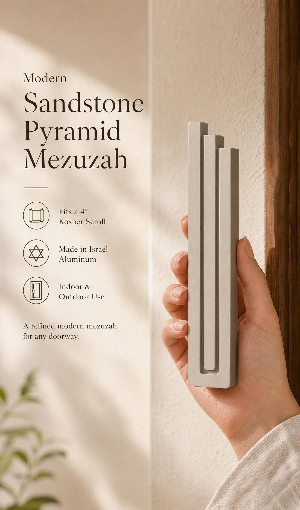 Elegant 9:16 scene of person holding the sandstone pyramid mezuzah with editorial text nearby in a neutral setting.