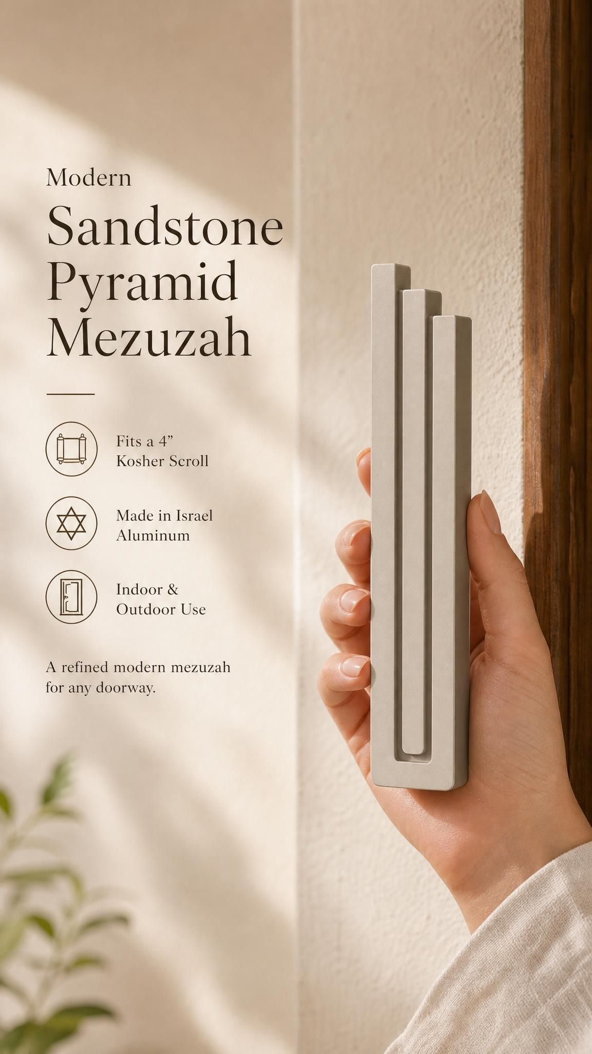 Elegant 9:16 scene of person holding the sandstone pyramid mezuzah with editorial text nearby in a neutral setting.