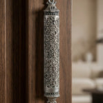 mezuzah affixed to an elegant, modern door in a minimalist interior