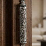 mezuzah affixed to an elegant, modern door in a minimalist interior