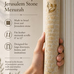 Hand displaying the Jerusalem stone mezuzah with warm natural lighting, refined typography, and generous space for editing in a 9:16 composition.