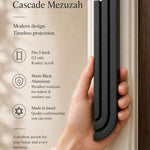 Close-up of Midnight Black Cascade Mezuzah made of aluminum with architectural rising bars, mounted on a doorway.