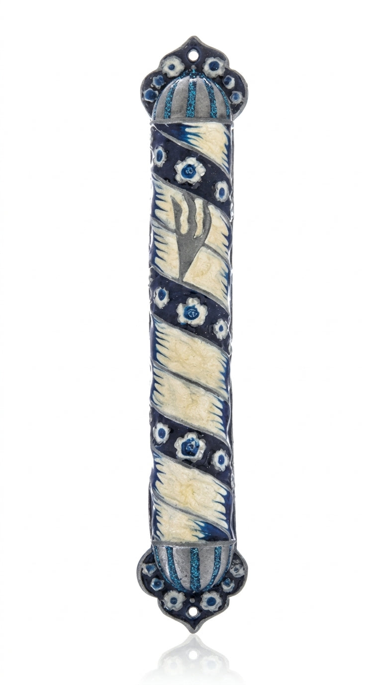 Blue pewter and enamel mezuzah with Hebrew engraved details and decorative motifs, displayed on a white background with soft reflection.