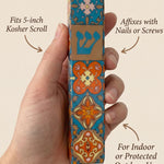 Person holding a ceramic Mezuzah showcasing size, material, and mounting details in a clean, minimalist layout.