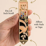 Person holding the mezuzah naturally, emphasizing its design and material details with a subtle, clean background for product focus.