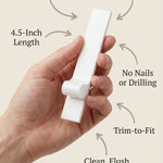 Person holding a 4.5-inch metal mezuzah with a clean, minimalist design and smooth surface, demonstrating handheld display for mounting.