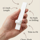 Person holding a 4.5-inch metal mezuzah with a clean, minimalist design and smooth surface, demonstrating handheld display for mounting.