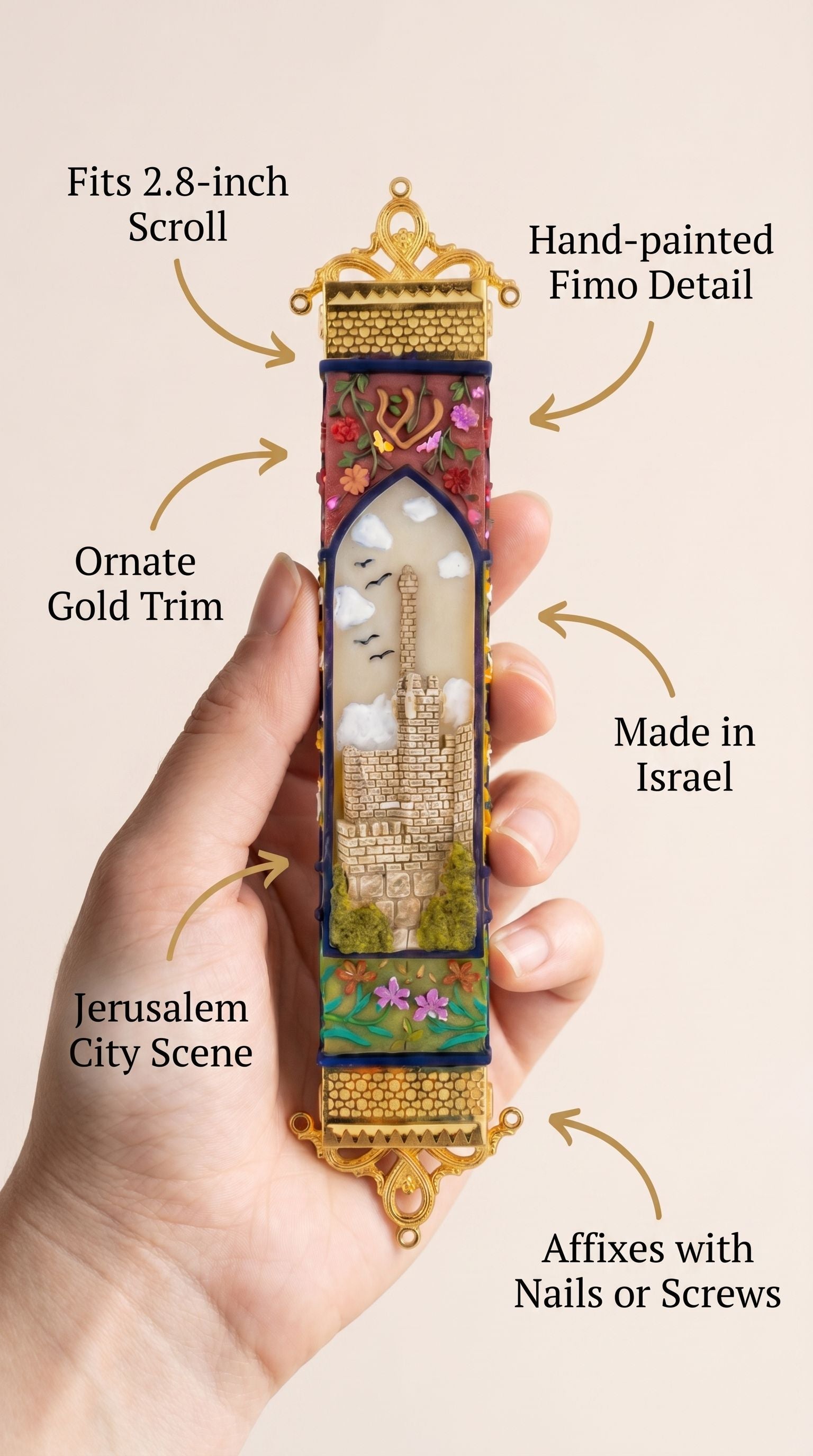 Person holding a decorative mezuzah made of Jerusalem-inspired design with a subtle, minimalist presentation.