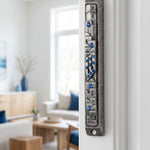 Sapphire Cityline pewter mezuzah with blue gemstone accents and city-inspired relief on interior doorway