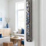 Sapphire Cityline pewter mezuzah with blue gemstone accents and city-inspired relief on interior doorway