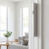 Modern brushed silver aluminum mezuzah mounted on a sleek interior doorway with contemporary decor