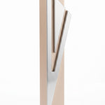 Modern Capital Shin champagne aluminum mezuzah case on white with a tall rectangular body and a large angular silver Hebrew Shin