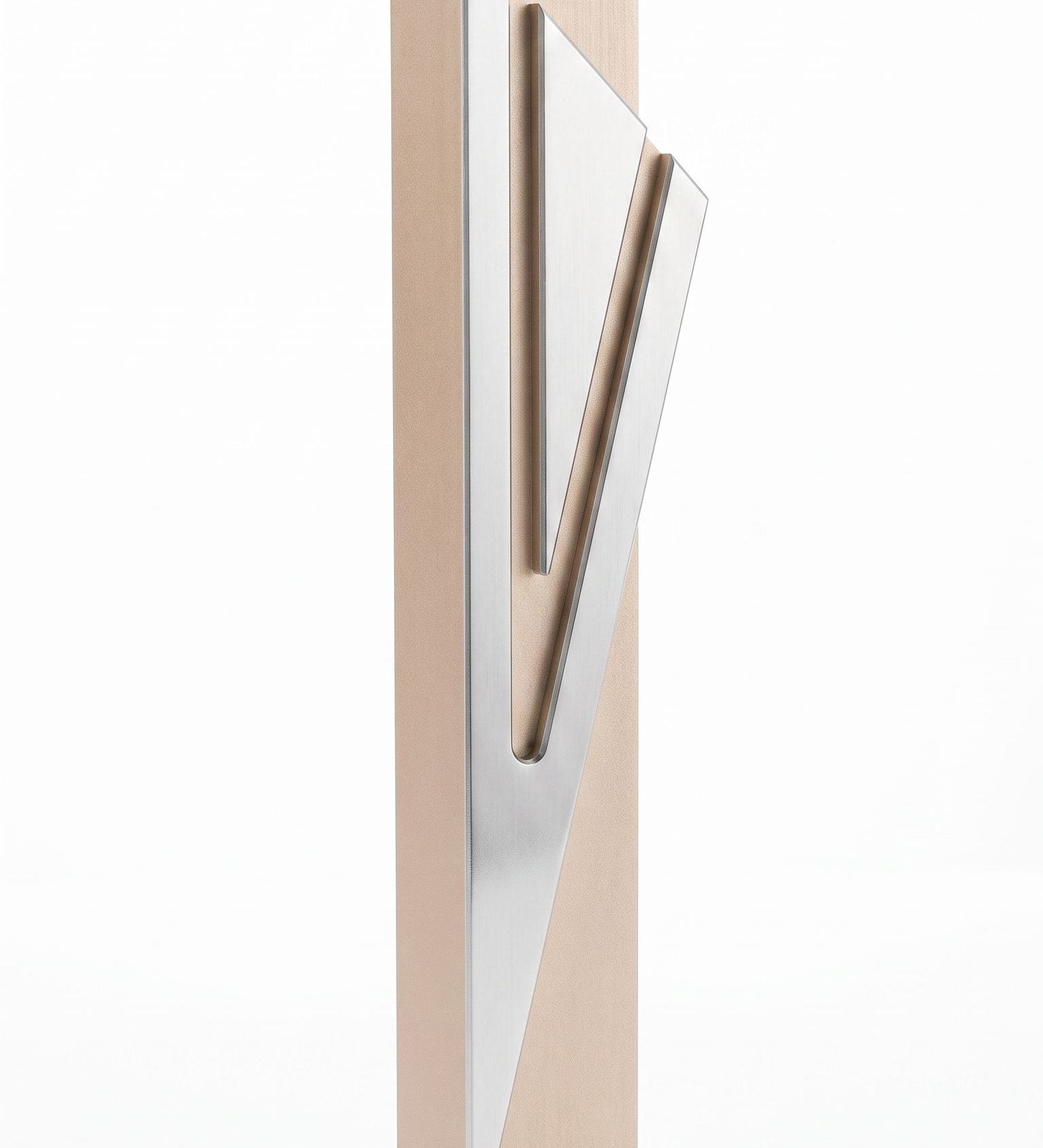 Modern Capital Shin champagne aluminum mezuzah case on white with a tall rectangular body and a large angular silver Hebrew Shin