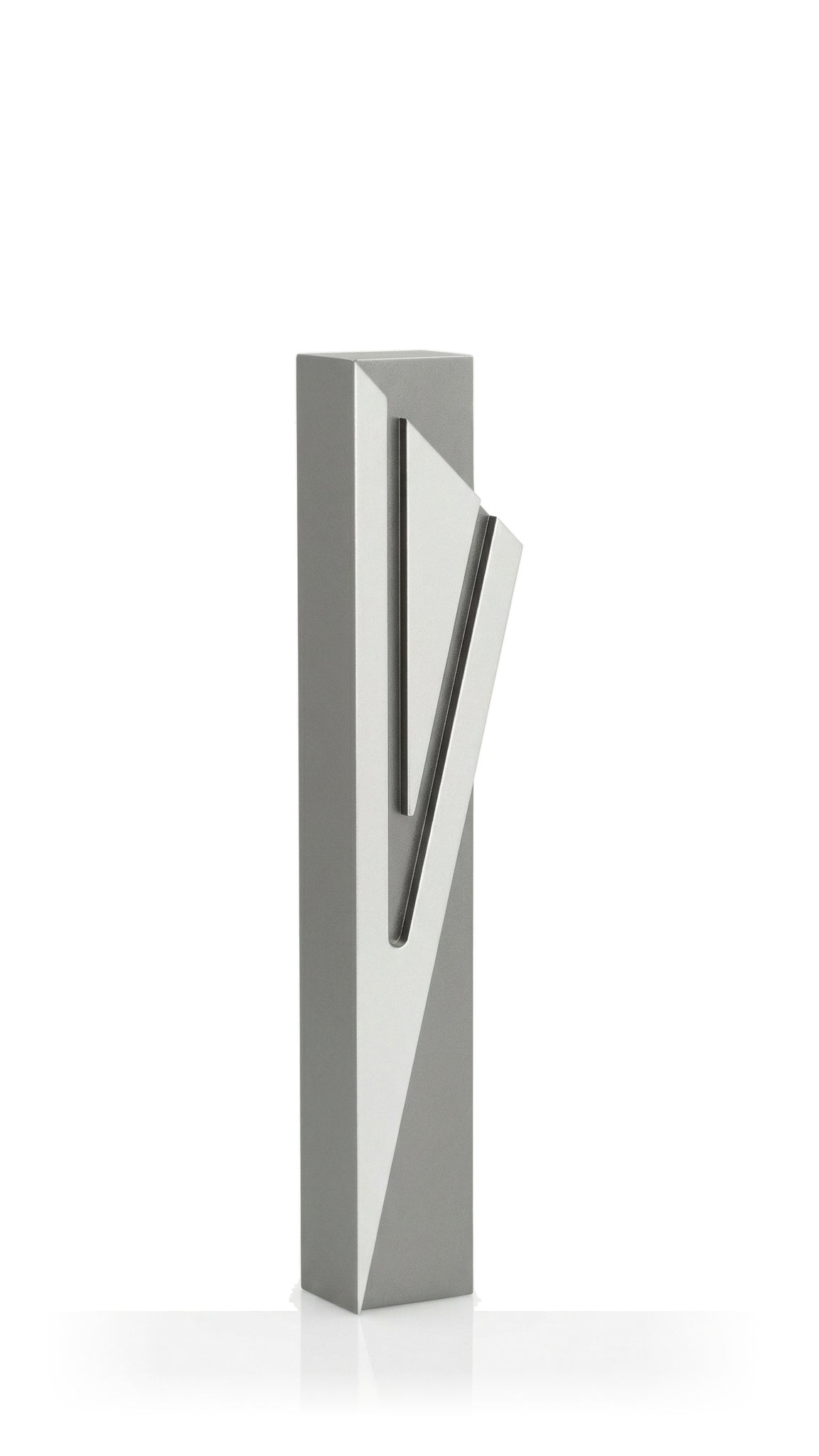 Architectural Capital Shin gray aluminum mezuzah cover with an oversized angular silver Hebrew Shin across its smooth rectangular body, uniting a neutral metallic palette with bold geometric detail for modern Jewish home decor