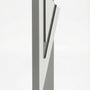 Modern Capital Shin gray aluminum mezuzah case on white with a neutral gray body and a large angular silver Hebrew Shin