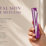 Hand holding a silver and purple aluminum mezuzah case in a premium editorial style with a Capital Shin mezuzah specifications highlighting the 5.5-inch body, 5-inch kosher scroll fit, and Israeli construction
