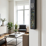 Hyper-realistic scene of a modern cement mezuzah with colorful stone inlay mounted on a narrow interior doorway on the right side, in a stylish home interior.