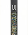 Contemporary cement mezuzah case with colorful stone inlay and Hebrew Shin symbol, suitable for modern interiors with clean design and bright background.