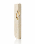 A tall, modern kosher mezuzah case holder made of textured beige Jerusalem stone with a polished gold-tone Mezuzah Shin flame cutout for modern home doorways